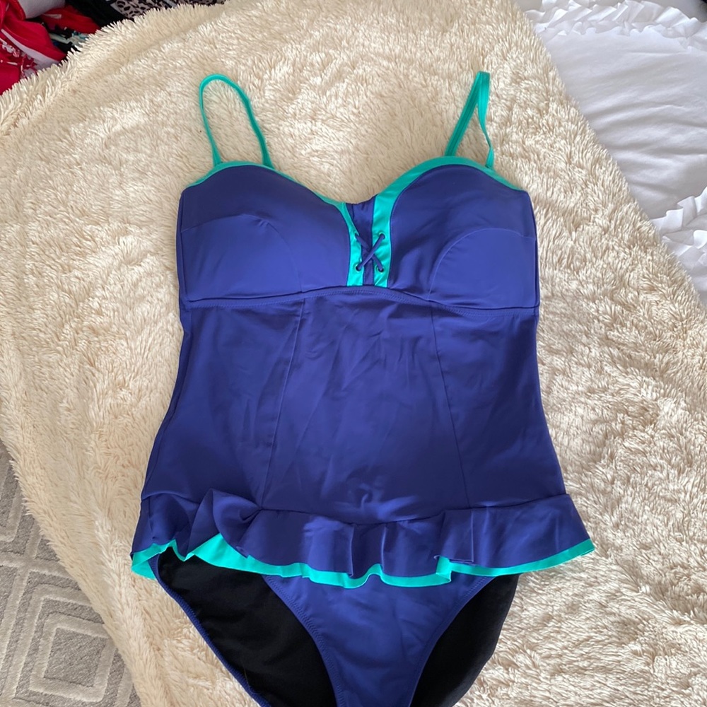 One piece navyand green one piece bathing suit.
